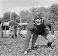 Tom Sullivan, Georgetown football player in stance ca.  between 1918 and 1920