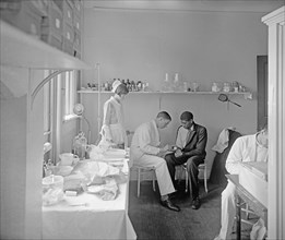 Doctor examining an African American man at Garfield Hospital, [Washington, D.C.] ca.  between 1918 and 1928