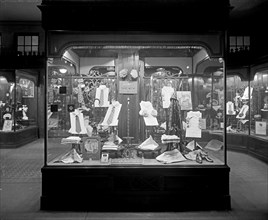 Raleigh Haberdasher's display window at night ca.  between 1918 and 1928