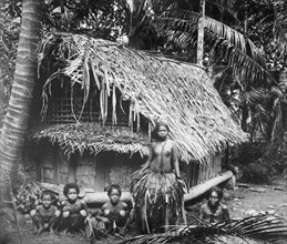 South Sea Islands, native family & house (hut) ca.  between 1918 and 1920