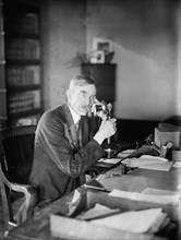 Man talking on a telephone, early 20th century ca.  between 1918 and 1920