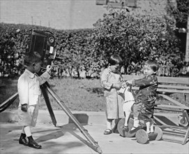 Koo & Sze children, one child looks to be operating a movie camera ca.  between 1918 and 1920