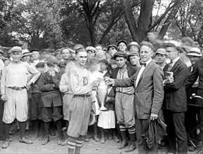 Member of sports team receiving trophy ca.  between 1918 and 1921