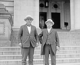 Samuel Gompers and Frank Walker; One figure holding cane at side ca.  between 1918 and 1920