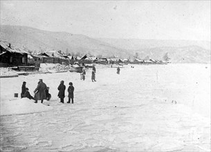 People on the shores of frozen Lake Backel, Czechoslovakia ca.  between 1918 and 1921