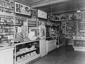 Interior of People's Drug Store, 7th and M Streets, Washington, D.C., with products in display cases and on shelves ca. between 1909 and 1932