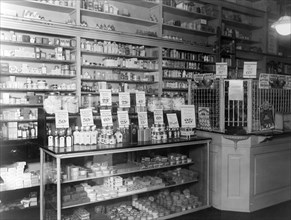 Interior of People's Drug Store, No. 9, 31st and M Streets, Washington, D.C., with products in display cases and on shelves ca. between 1909 and 1932