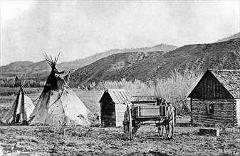 A building and a teepee at the Colville agency, Colville Indian Reservation ca. 1909