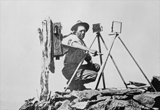 Signal station in the Rockies, showing telephone installation and signal man using heliograph ca. 1909