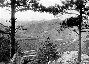 Denver Mountain Park, Golden, Colorado. View through trees overlooking road and mountains ca. 1909