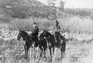Edd Ladd, full-blood Apache Indian, of the Jicarilla Reservation, New Mexico, with Indian Commissioner Cato Sells, on horseback ca. 1909