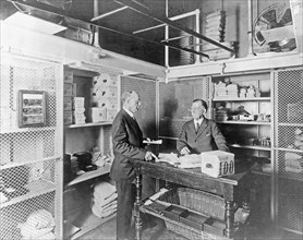Treasury Department, men working inside the cash room vault for daily working funds ca. 1909