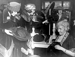 Women at the fourth annual rummage sale of the Child Welfare Society ca. 1909