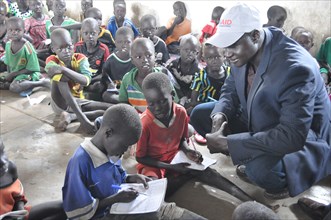 South Sudan has the highest rate of out-of-school children in the world, here some children receive education via a USAID worker ca. 28 August 2017