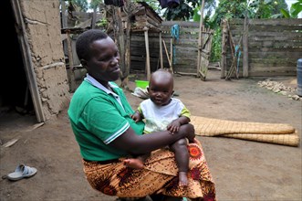 Evas, 34 years old, with her 8 month old daughter Linette in Uganda ca. 14 March 2018