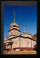 Log Church of Saint Nicholas (1846), southwest view which was originally built near the site where Lake Baikal drains into the Angara River, Listvianka, Russia; 1999