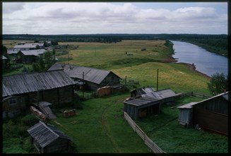 Log houses along Kimzha River, view south, Kimzha, Russia; 2000