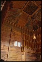Log Church of the Prophet Elijah (1690-96), interior, northeast corner, with icon screen and ceiling paintings, Belozersk, Russia; 1999