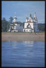Church of St. Dmitrii (1700-09), and Church of St. Sergius Radonezh (1739-47), at Dymkova Sloboda, east panorama with Sukhona River, Velikii Ustiug, Russia 1998.