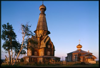 Church of the Dormition (1674) (left), and Church of St. Afanasii (1857) (right), northwest view, Varzuga, Russia; 2001
