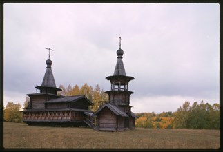 Log Church of the Savior and bell tower (1700), northwest view, from the village of Zashiversk, moved and reassembled in the Outdoor Architecture and History Museum at Akademgorodok, Russia 1999.