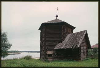 Log Church of the Epiphany (also known as Nativity of the Virgin), (1617), northwest view, with Kama River in background, Pianteg, Russia; 2000