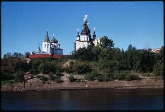 Trinity Monastery, east panorama with Trinity Cathedral (1715) (right), and the Church of Saints Peter and Paul (1755) (left), and Tura River in foreground, Tiumen', Russia 1999.