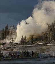 Grand Geyser and visitors on boardwalk in Upper Geyser Basin in Yellowstone National Park; Date: 19 June 2012