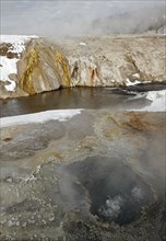 East Chinaman Spring with Cascade Geyser across the Firehole River in Yellowstone National Park; Date: 7 January 2015