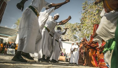 Muslim men dance at a ceremony in Garowe, Puntland ca. 3 June 2015