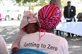 A member of the Namibian Onyaanya-Gwaanaka ARV Refill Group with her HIV-negative child ca. 1 June 2017