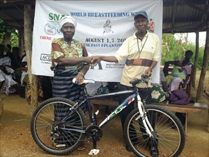 Health promoters use bicycles to reach remote communities in Sierra Leone ca. 3 August 2012