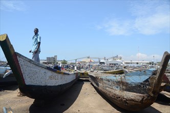 Boats on dock at fishing port of Tema in Ghana  ca. 19 October 2011