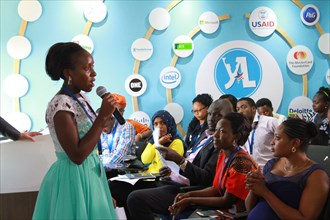 Through the Young African Leaders Initiative (YALI), a young woman speaks to a crowd in Kenya ca. 13 January 2017