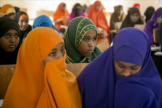Young Muslim women listen during a teacher training session in Mogadishu or Garowe via the Somali Youth Learners Initiative (SYLI) ca. 16 June 2015