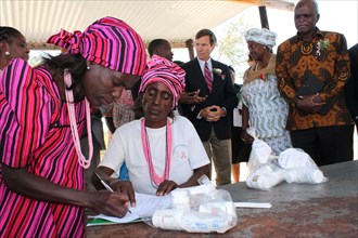 Namibia's Onyaanya-Gwaanaka Refill Group distributing ARV community members with US Ambassador Thomas Daughton looking on ca. 1 June 2017, 13:28