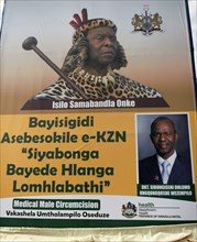 A sign featuring King of the Zulus Goodwill Zwelithini, promoting Voluntary Medical Male Circumcision in the province of Kwazulu Natal South Africa ca. 2018
