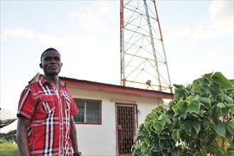 A local radio host stands outside radio station KR 94.5 as it is known, which gives the people of Ganta, Liberia and the surrounding areas plenty of talk radio, especially politics, culture, and the w...