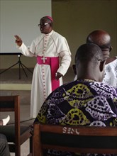 A bishop teaches an interfaith community group about the importance of sustainable fishing, Takoradi, Ghana  ca. 7 June 2011