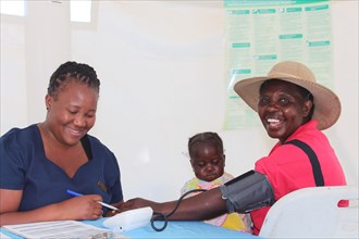 Woman having her blood pressure taken in a clinic in Zimbabwe ca. 28 June 2016