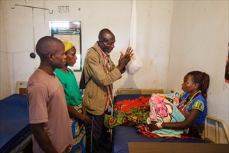 Safe Motherhood Action Group speaking with new mother at the Mundabi Rural Health Center, Mundabi, Zambia ca. 7 March 2017