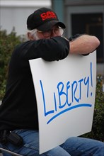 Attendees holding signs at a Tea Party rally in Dallas, TX (one of the first in the United States on Feb. 26 2009)