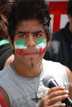 Iranians in Texas taking part in a Freedom for Iran / Green Revolution rally at Dallas City Hall plaza in downtown Dallas, TX; rally speaker ca. June 2009