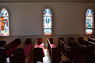 Interior of the United Methodist Church in Utopia, TX; empty church pews