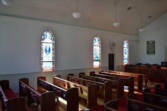 Interior of the United Methodist Church in Utopia, TX; empty church pews