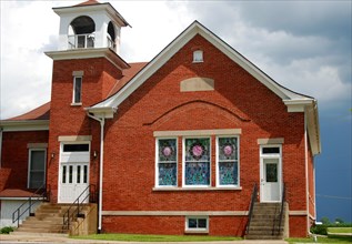 Red brick church on the plains of East Central Illinois, Hindsboro Christian Church on a cloudy day