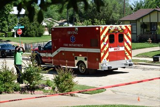 First responders; firemen and paramedics, help trapped construction worker trapped in a trench; Ambulance arrives to the scene of the emergency Irving, TX USA