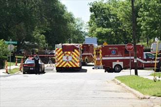 First responders; firemen and paramedics, help trapped construction worker trapped in a trench; Irving, TX USA