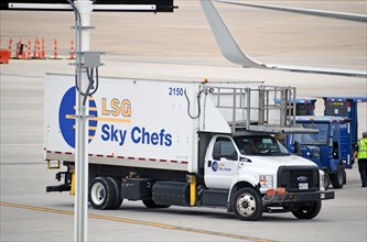 Dallas-Ft. Worth Airport: An LSG Skychefs truck prepares to service an American Airlines Boeing 737 at Terminal D South at DFW Airport