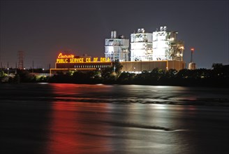 Public Service Company of Oklahoma plant along the Arkansas River in Tulsa, Oklahoma at night